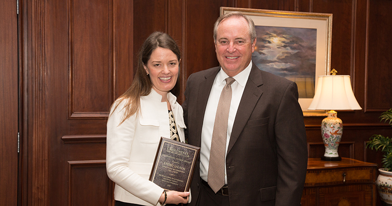 Esther Larson, MPSA ‘06, receiving the 2017 Outstanding Alumni Award for the Bush School from Dean Mark Welsh