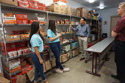 Dr. Brown talks to others at a food pantry