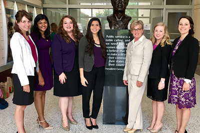 Consulting Capstones - Photo of female Bush School students with Dr. Kerr