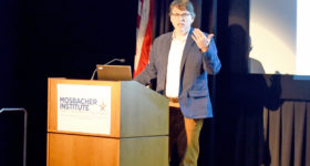 Photo of Dr. Thomas Dee speaking
