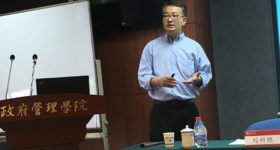 Dr. Liu giving a speech