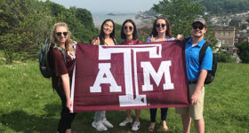 Students with Texas A&M flag