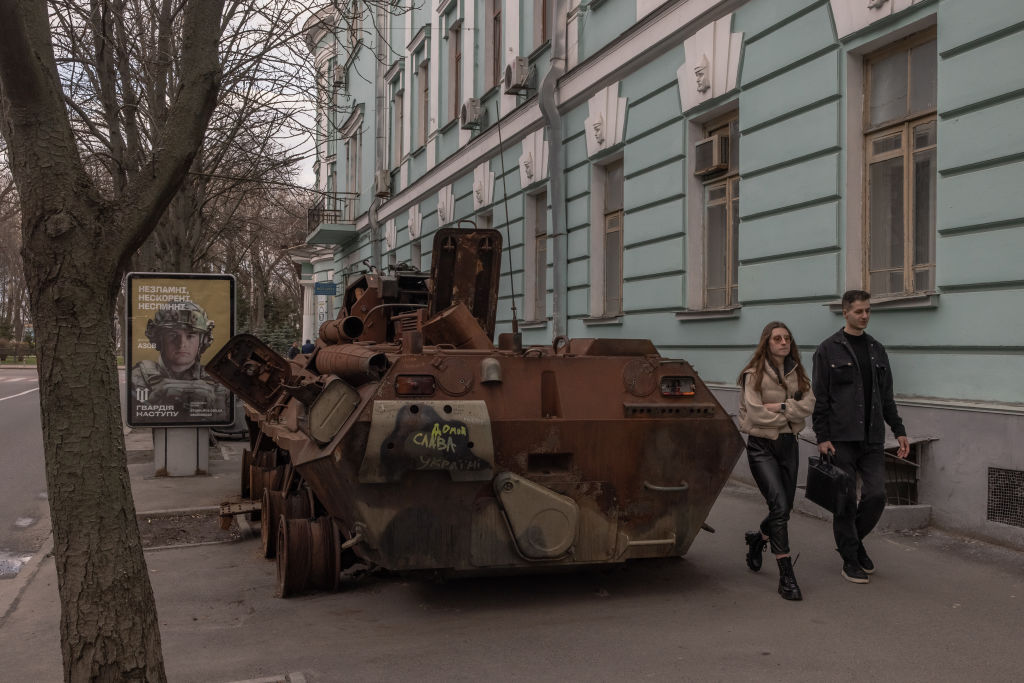 People walk past a destroyed Russian armored military vehicle on display on March 27, 2023 in downtown Kyiv, Ukraine. A war-time curfew in the capital city was moved back an hour from 11 p.m. to midnight beginning March 26.
Roman Pilipey/Getty Images