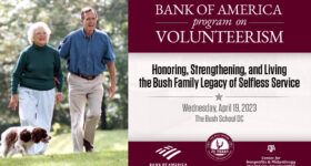 President Bush and Barbara Bush walk their dog