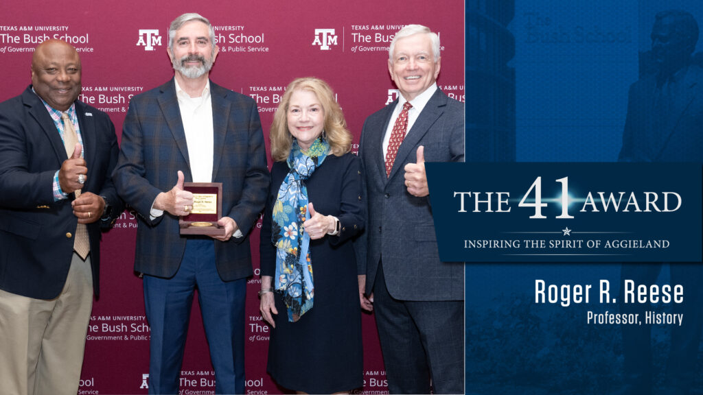 Dr. Roger Reese receiving 41 award from Bush School Dean Frank Ashley