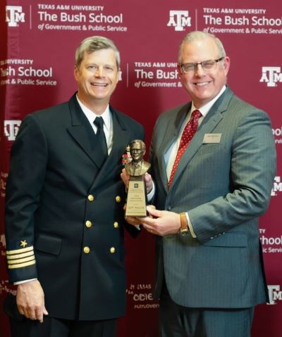 Capt. Jeff Benson '03 receiving his award from Dean John Sherman