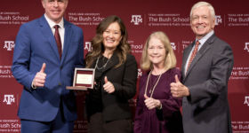 A photo of Aric Short; his wife, Tanya Pierce; and the creators of the 41 Award, Linda Vincent and Stephen Vincent '73. They are holding the 41 Award and giving a thumbs up.