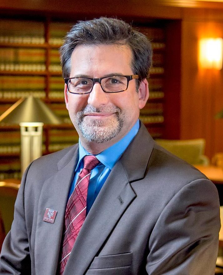 A head-and-shoulders shot of a smiling Robert Ahdieh, dean of Texas A&M Law School